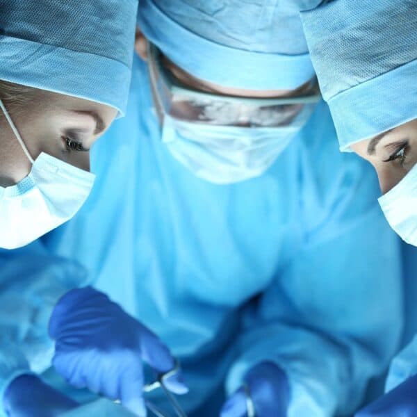 3 surgeons in operating room