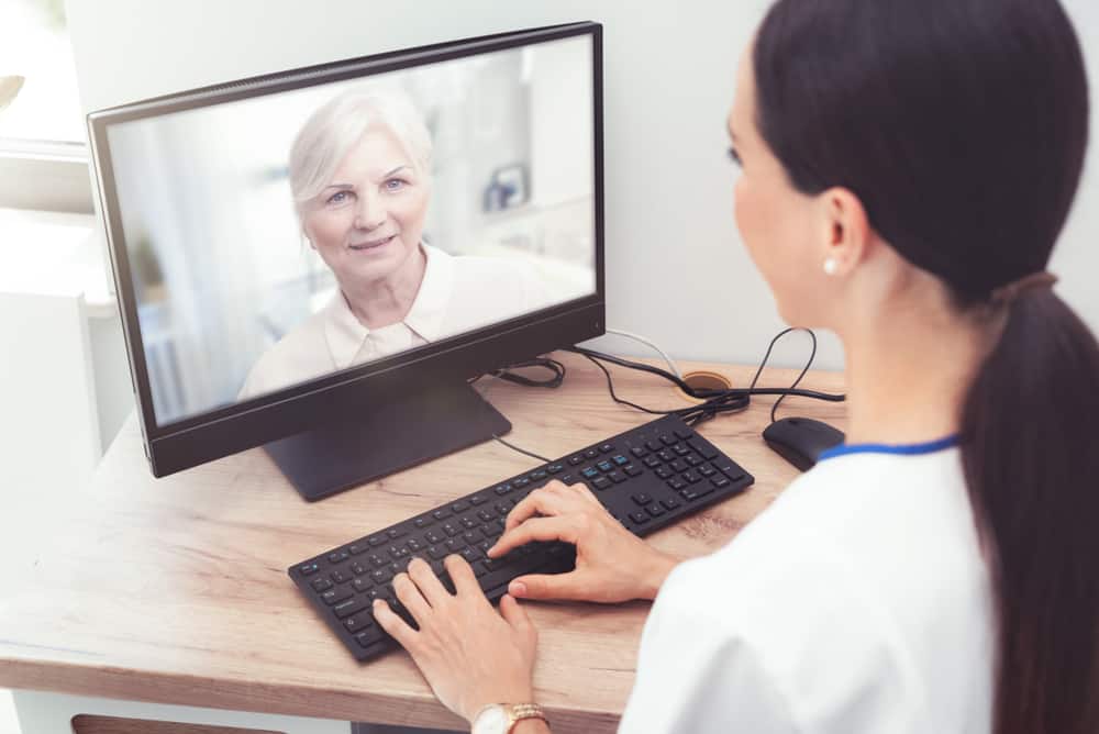 doctor talking to patient via telehealth 