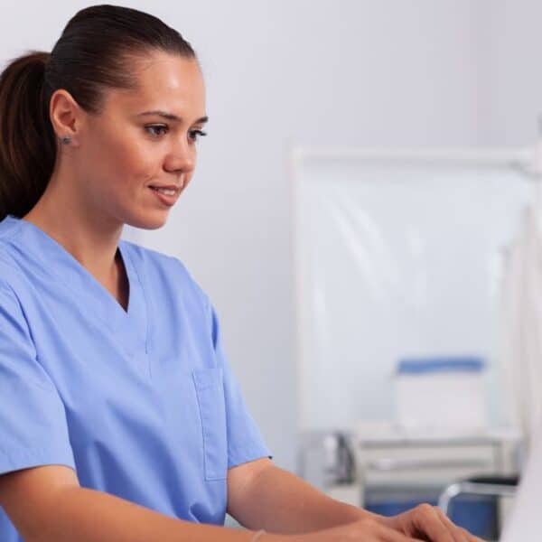 Person implementing Harmony Healthcare's tips for a successful OP CDI program